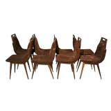 Set of eight brown suede and exotic wood dining chairs
