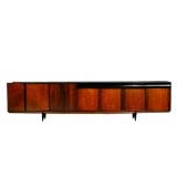 An extra long rosewood and black laminate credenza