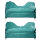 A pair of scroll arm light blue settees with white painted bases