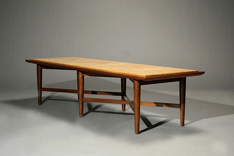 An X base walnut coffee table with elm burl inset top