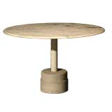 A round marble dining table with cement base