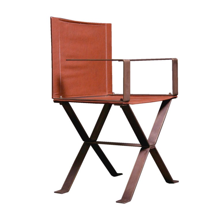 A set of eight bronze and leather directors chairs