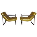 Pair of green leather and bronze arm chairs