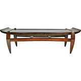 Solid rosewood coffee table with arched top by Jean Gillon