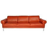 Burnt orange leather and steel sofa by Maison Jansen