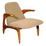 Sculpted wood and upholstered arm chair by Allen Ditson