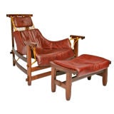 Leather arm chair and ottoman by Jean Gillon