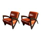 A pair of curved jacaranda and red leather chairs, Brazil