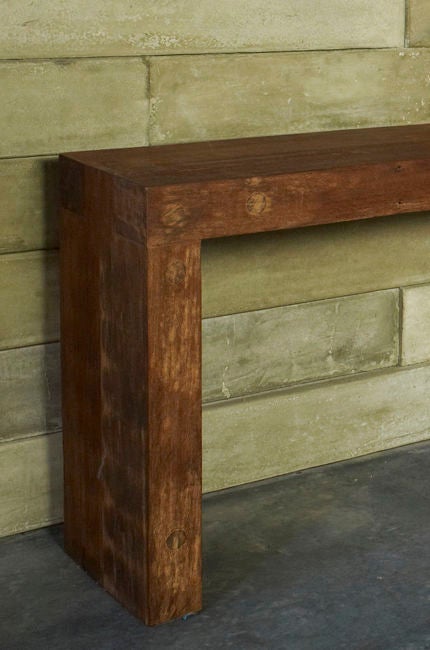 A long (as the name suggests) console table made by hand from solid reclaimed Ipê wood by the young Brazilian designer Zanini, son of noted Brazilian architect and designer Jose Zanine Caldas.  Zanini continues in the tradition of his