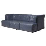 A blue leather zipped up sofa by De Sede