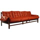 A rosewood and red leather sofa with black pigskin straps