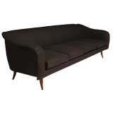 Curved sofa by Joaquim Tenreiro
