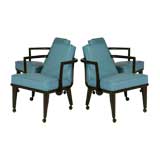 Set of four blue leather rolling arm chairs by Monteverdi-Young