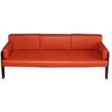 Rosewood and red leather sofa