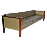 Rosewood and leather sofa by Michel Arnoult