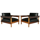 Pair of Brazilian rosewood and black leather lounge chairs
