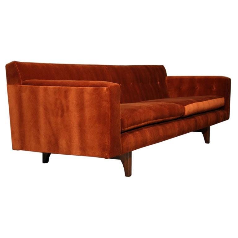 A sofa of rust colored mohair on mahogany legs designed by Edward Wormley for Dunbar.  COM only -- we will reupholster for you for an additional cost.