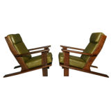 Pair of Brazilian paddle arm lounge chairs