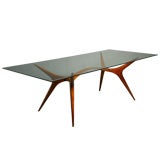 Sculpted exotic wood and glass dining table by Scapinelli