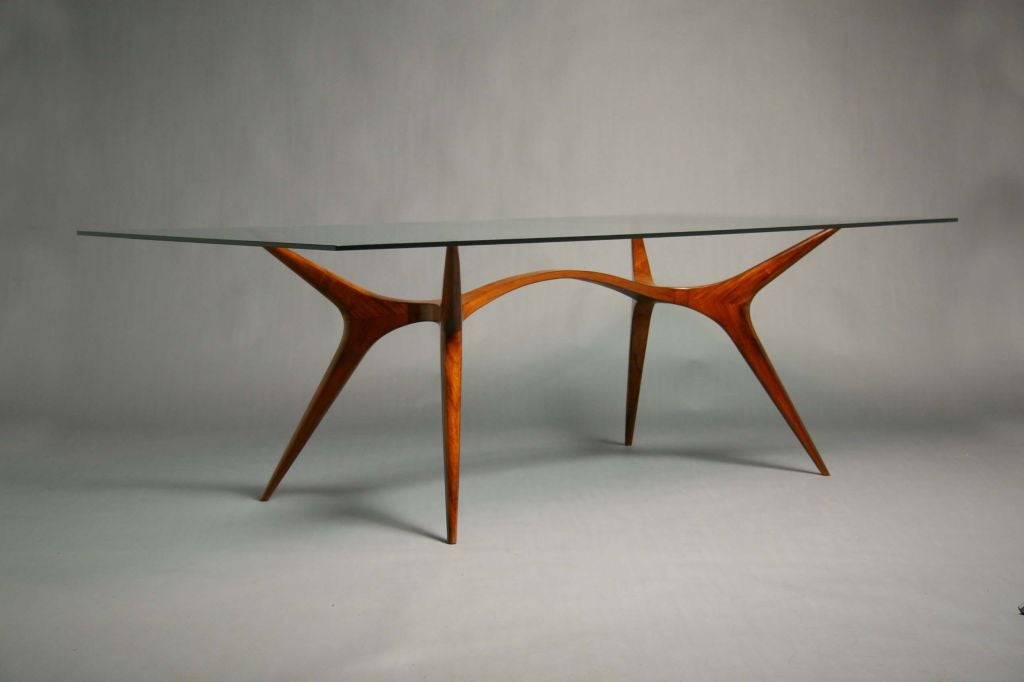 Although Scapinelli worked out of Sao Paulo, his Italian origins seem to always shine through clearly in his exquisitely sculpted wood furniture constructions, as with this simple yet elegant dining table.