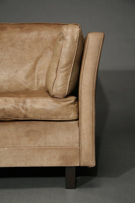 Curved leather Scandinavian tuxedo sofa