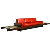 Rosewood and red leather sofa with floating ends by Celina