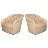 Pair of tufted light pink leather lounge chairs by Ward Bennett