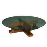 A rosewood base coffee table with glass top by Celina