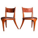 Pair of three legged wood and leather chairs by Allen Ditson