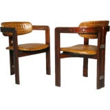 Pair of leather and exotic wood Pamplona chairs, Augusto Savini