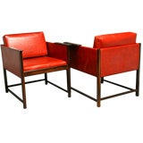 Pair of rosewood and red leather arm chairs