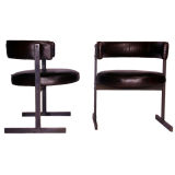 A pair of bronze and leather side chairs by Jorge Zalszupin A pair of bronze and leather side chairs by Jorge Zalszupin