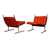 Pair of bronze frame red leather lounge chairs by L'Atelier