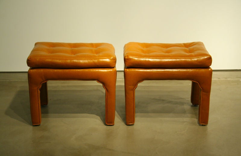 Pair of caramel leather wrapped ottomans or benches