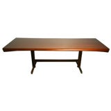 Curved top dining table by Novo Rumo