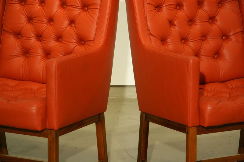 Swedish A pair of high tufted leather and teak arm chairs