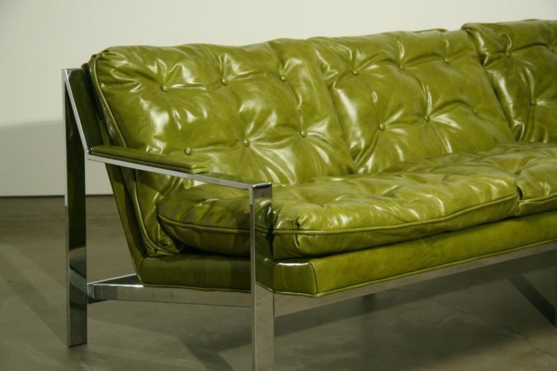 This attractive rare chrome sofa designed by Milo Baughman is more often seen as a lounge chair.  The sofa has recently been reupholstered in a bright green leather.