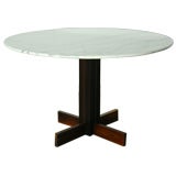 A rosewood and round marble top dining table