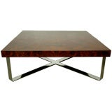 A rosewood and chrome coffee table by Milo Baughman