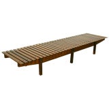 A long "Mucki" bench or coffee table by Sergio Rodrigues