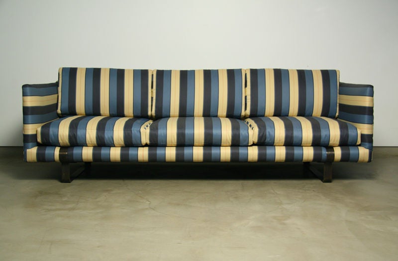 Striped fabric tuxedo sofa with thick bronze base