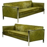 Pair of green hair on hide and chrome sofas