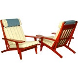 Pair of Hans Wegner GE375  red oak and fabric lounge chairs