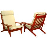 Pair of Hans Wegner GE375  red oak and leather lounge chairs