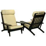 Vintage Pair of Hans Wegner GE375 ebonized oak and leather lounge chairs