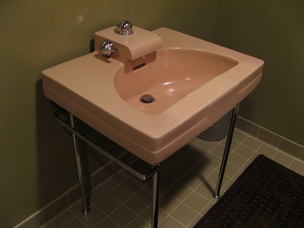 Beautiful sink designed by Henry Dreyfuss,the famous American industrial designer. made in the US by Crane<br />
The color is labeled 'suntan'