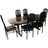 Roche Bobois Smoke Glass table with 6 Chairs.