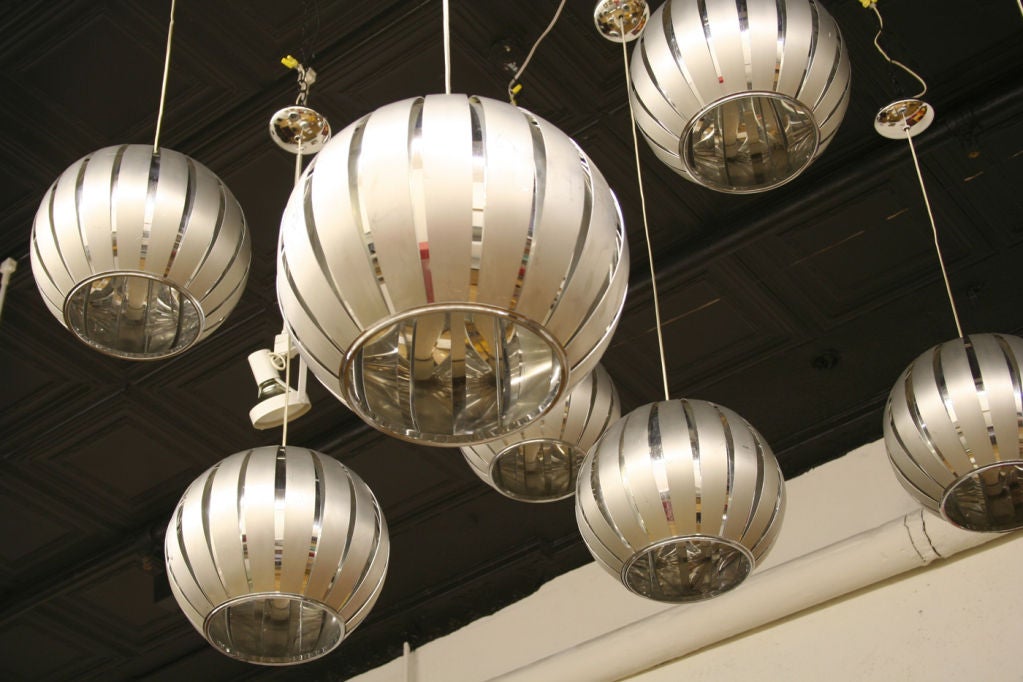 Ceiling fixture of circular form in brushed and polished metal.2400 EACH 15000 FOR ALL