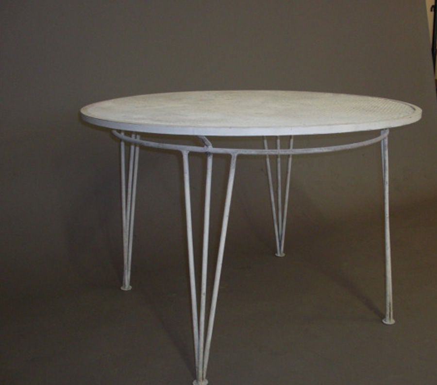White painted metal table round with mesh top