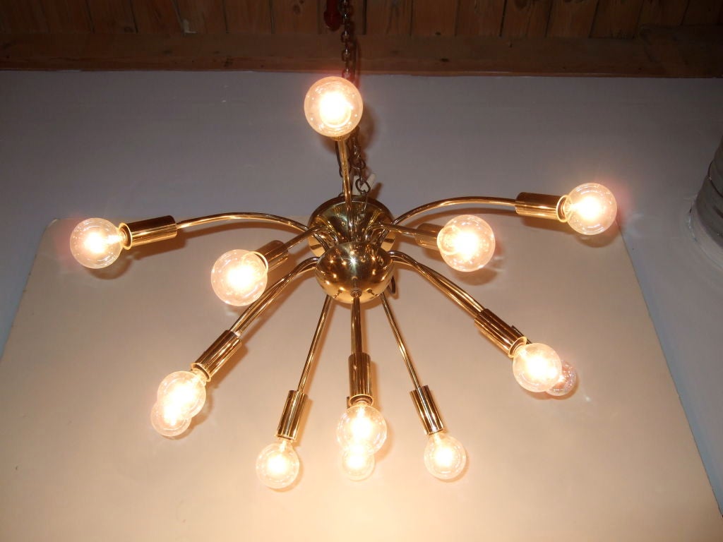 Out of this world, solid brass drooping sputnik fixture with 13 arms. With its unique space-age design, it's a wonderful addition to any retro or modern environment.<br />
<br />
Please visit our gallery in Stamford, Connecticut located at 583